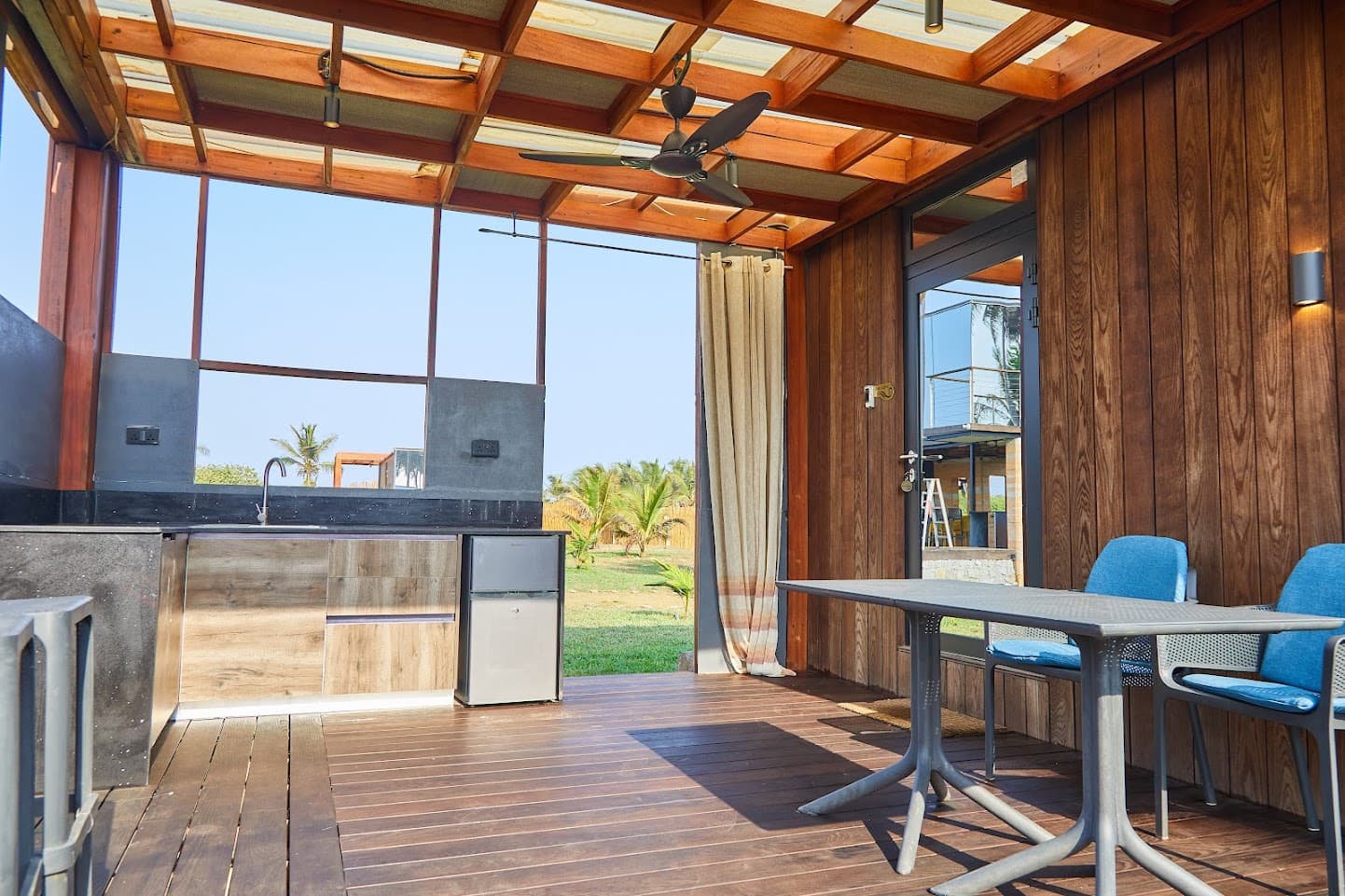 The warm wooden patio and outdoor living space at Sojourn Cabins