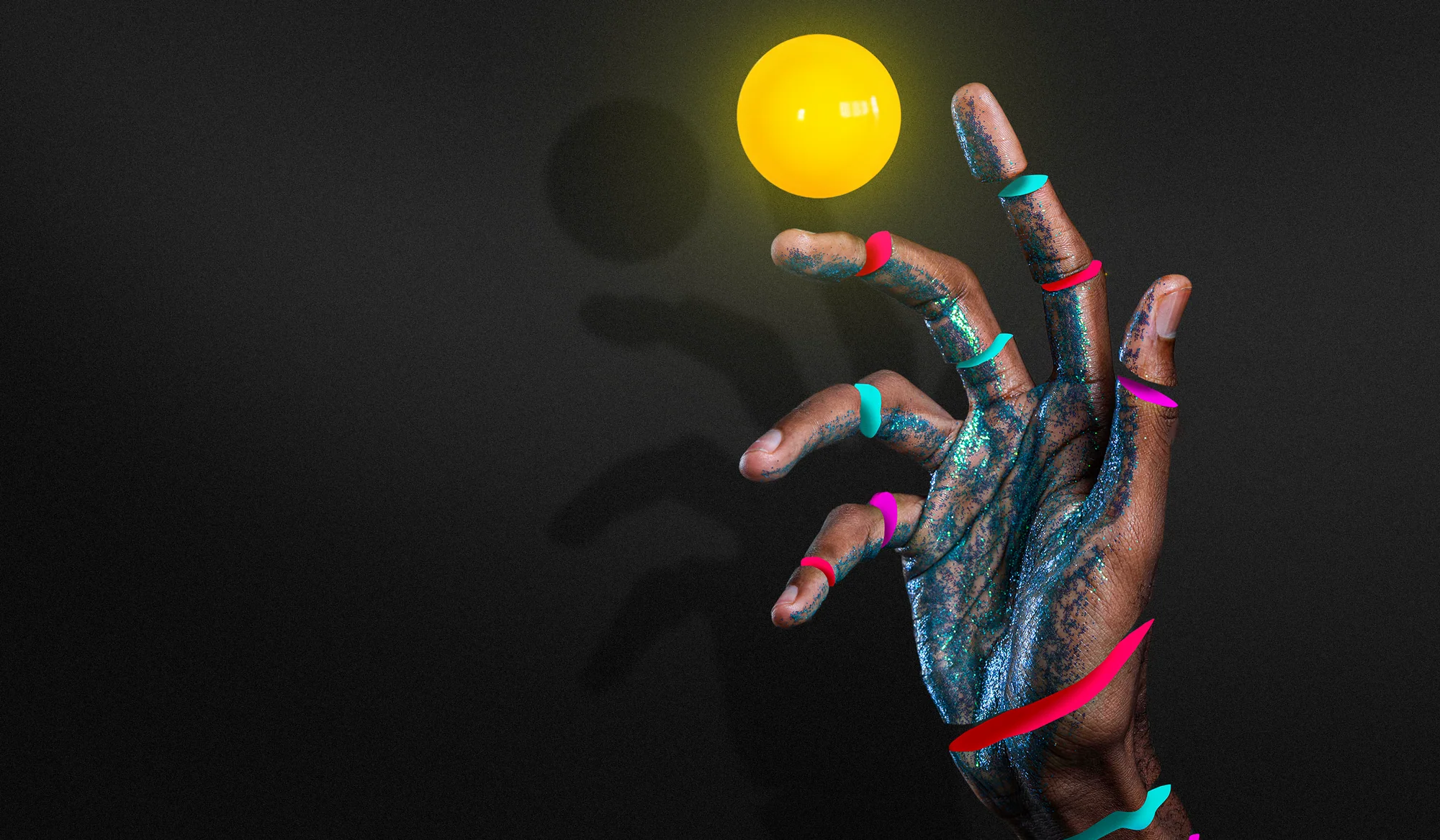 A hand shaping a colourful creative idea